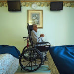 elderly man in wheelchair in nursing home