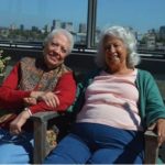 two senior women seated