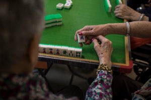 Playing mah-jongg at a nursing home in New Jersey.