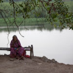 An elderly woman along the Yamuna River near New Delhi