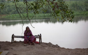 An elderly woman along the Yamuna River near New Delhi