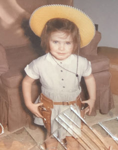 young Kristi Denton Cohen in cowgirl outfit