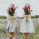 2 young girls with flower bouquets