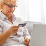 woman exames her credit card